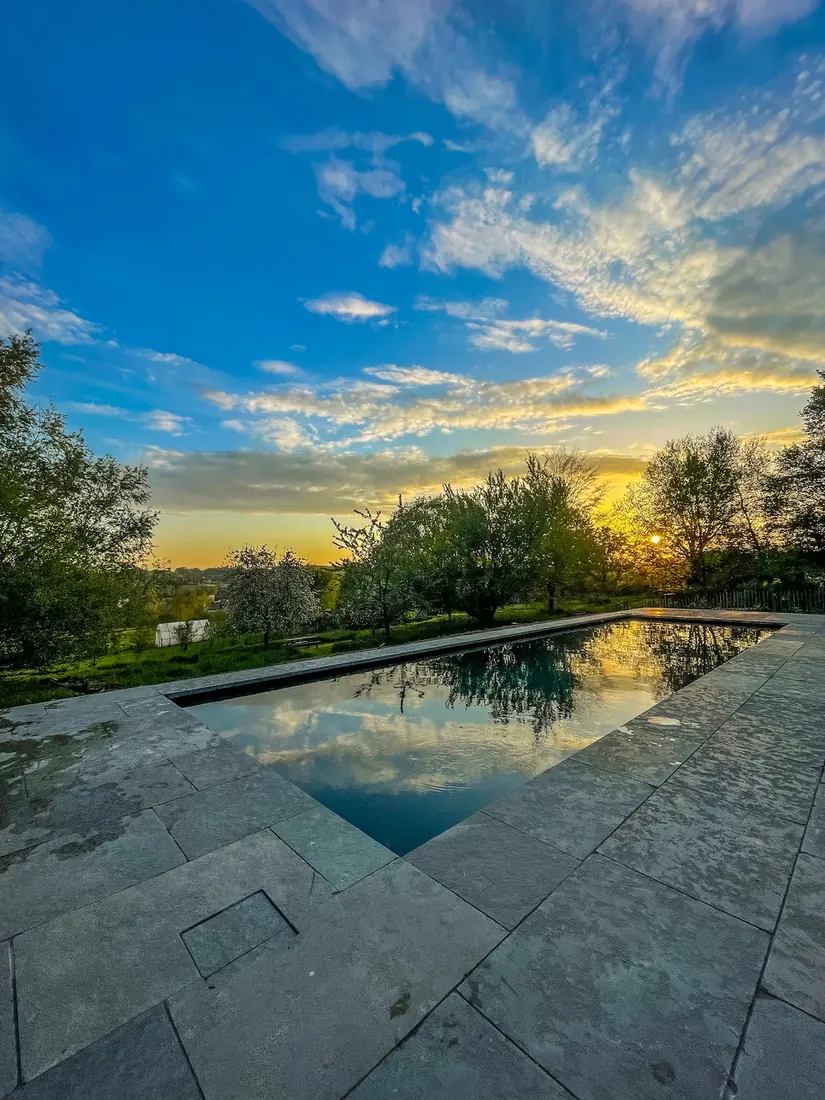 Pool and garden at Les Plachettes in Flobecq