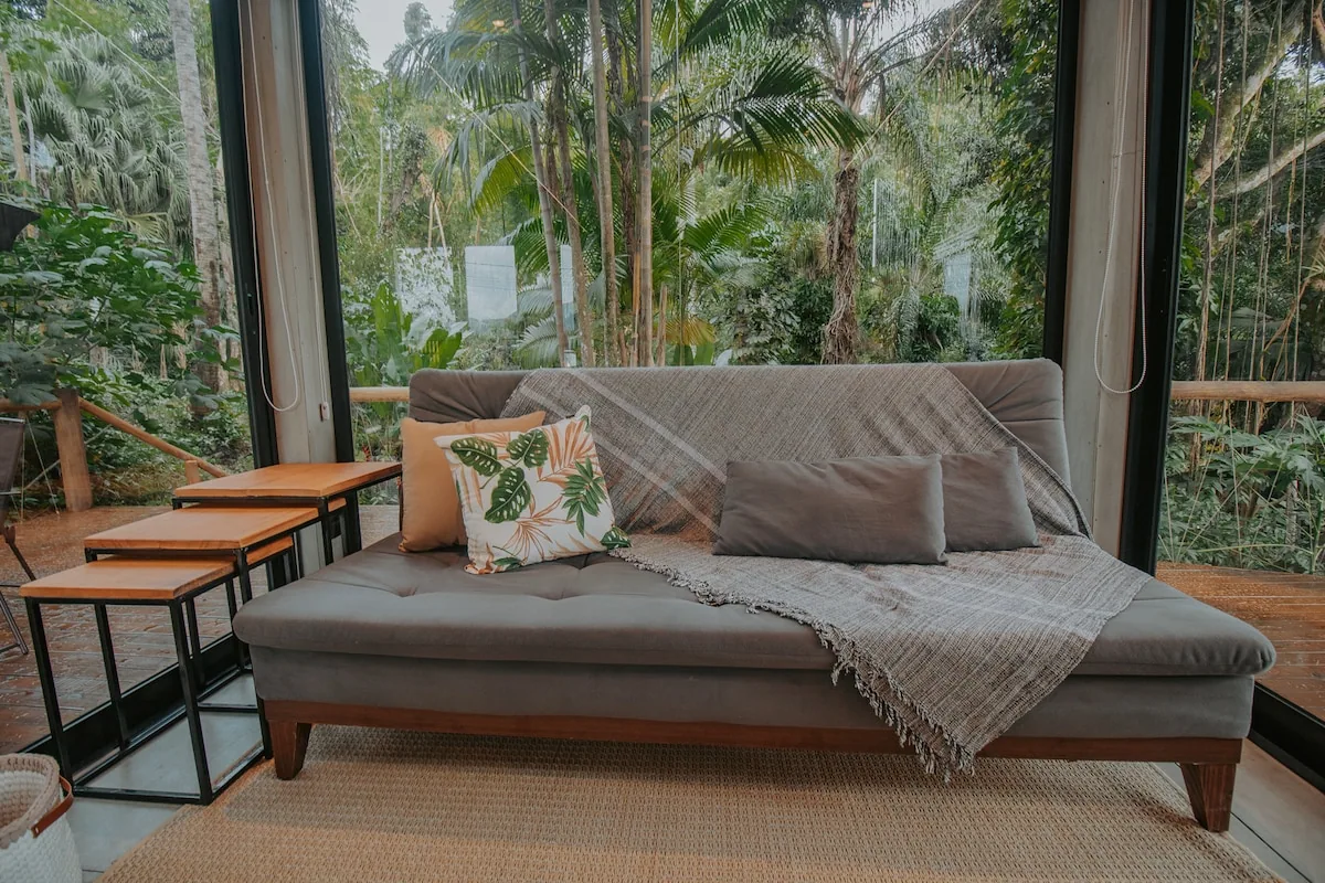 Living room with sofa bed. at Casa Natu Ilhabela Studio Feiticeira with Jacuzzi in Ilhabela