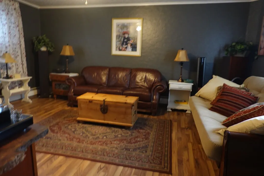 Leather seating, armchair and wooden chest coffee table at Cozy House in Ridgway
